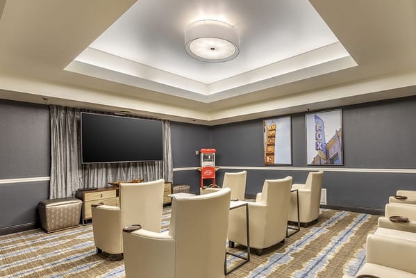 Interior view of a common area with seating and a TV