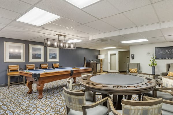 Common area with a pool table and seating