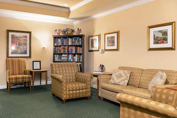 Cozy common area with seating and bookshelves
