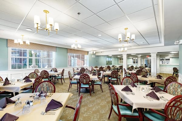 Spacious dining room set for a meal
