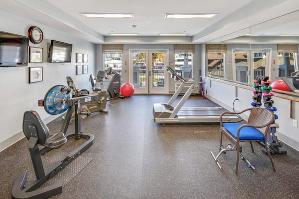 Well-equipped fitness room with exercise machines