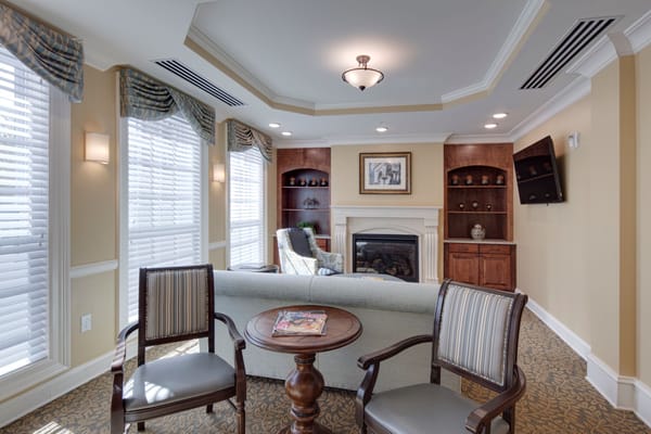 Cozy common area with comfortable seating and a fireplace