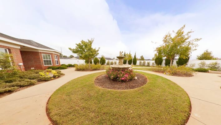 Beautiful garden with a fountain and walking paths