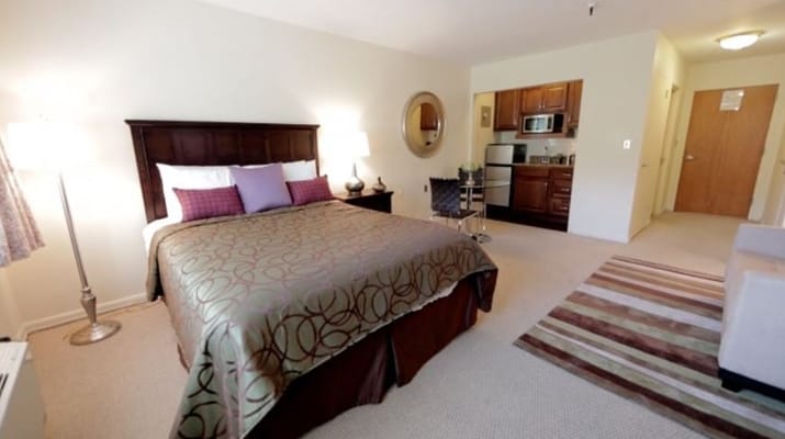 Private resident room with bed and kitchenette