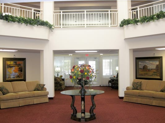 Spacious lobby with seating and floral centerpiece