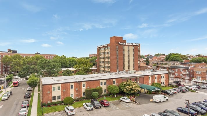 Aerial view of Castle Senior Living facility with parking