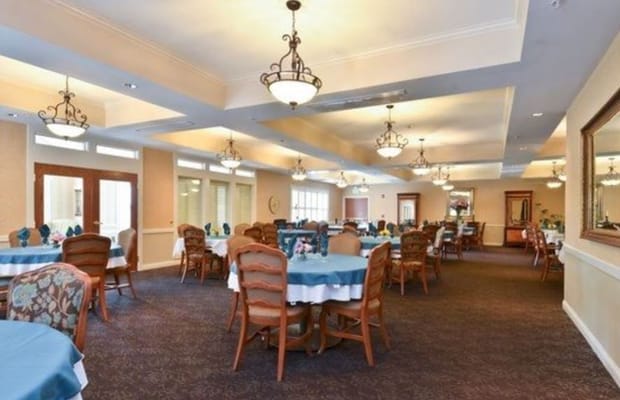 Interior view of a dining room with tables and chairs