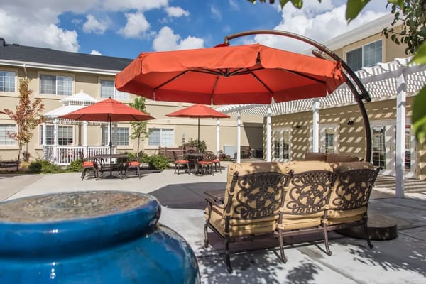 Outdoor seating area with umbrellas and courtyard