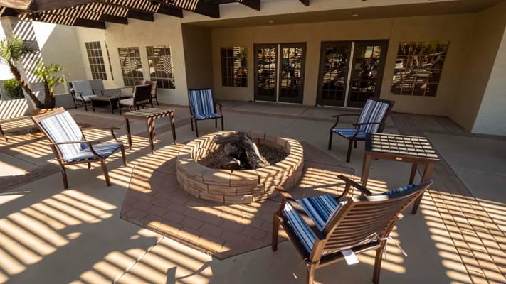 Outdoor seating area with a fire pit and chairs