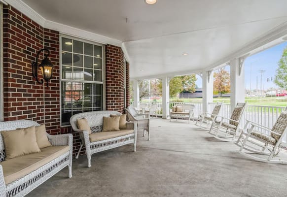 Outdoor seating area with rocking chairs