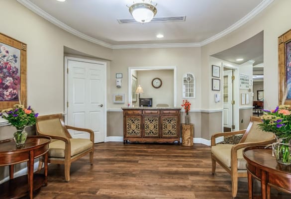 Interior common area with seating and decorative flowers