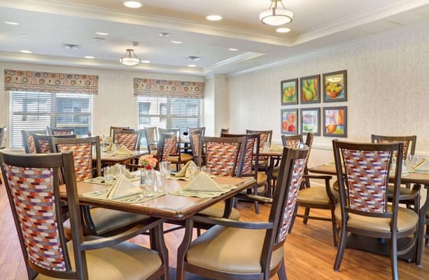 Bright dining area with tables set for meals