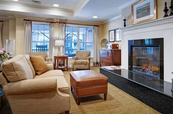 Well-furnished common area with seating and fireplace