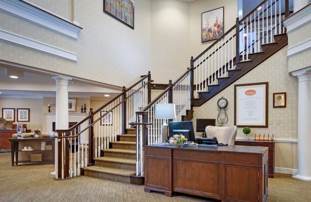 Lobby area with staircase and reception desk