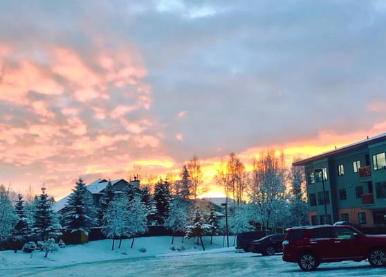 Sunset view of a snowy outdoor space near the facility