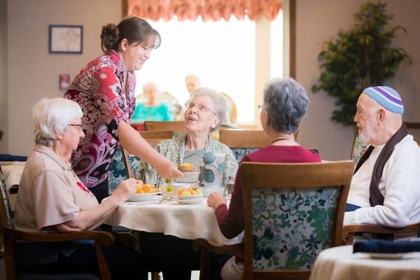 Residents enjoying a meal in the dining area