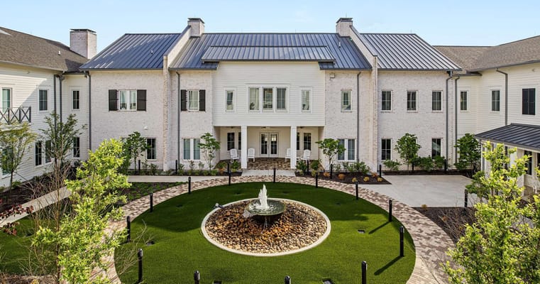 Outdoor courtyard with fountain and seating area