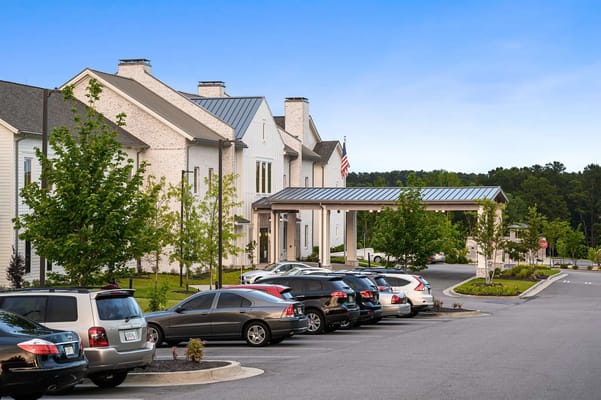 Exterior view of Claiborne at West Lake with parking lot