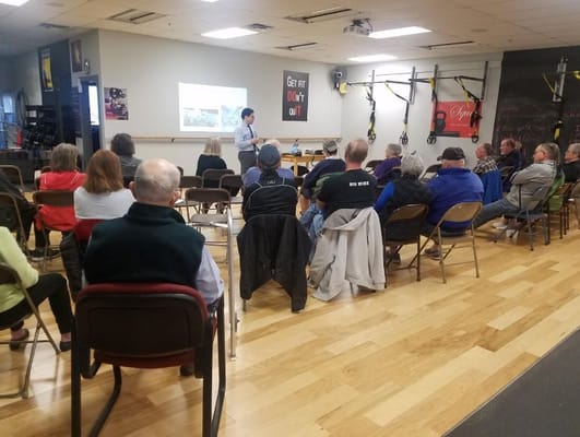 Residents attending a fitness class in an activity room