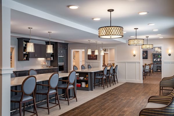 Interior view of a modern communal kitchen and dining area