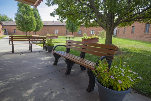 Benches and flower pots in a garden area
