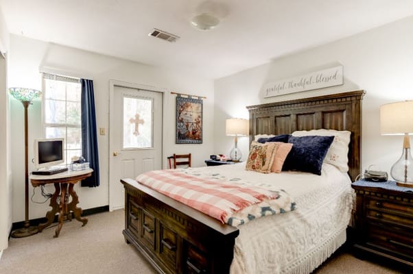 Cozy resident room with bed and personal decor