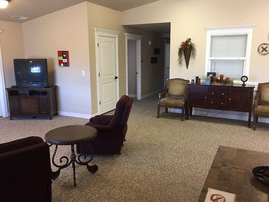 Interior common area with seating and a television