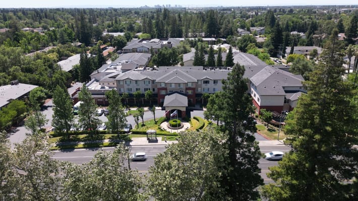 Aerial view of a senior living facility with landscaping