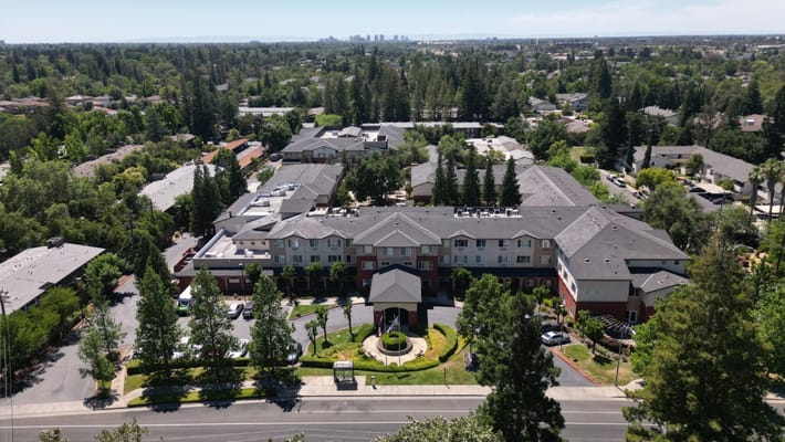 Aerial view of a senior living facility and surrounding area