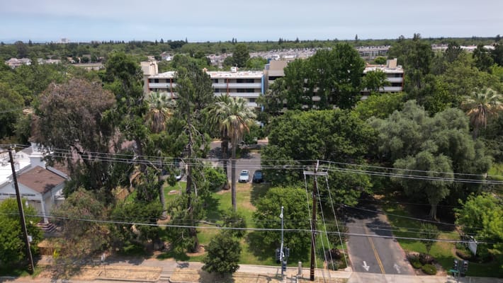 Aerial view of the facility with green landscaping