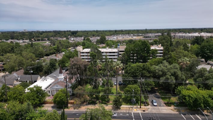 Aerial view of the senior living facility surrounded by greenery