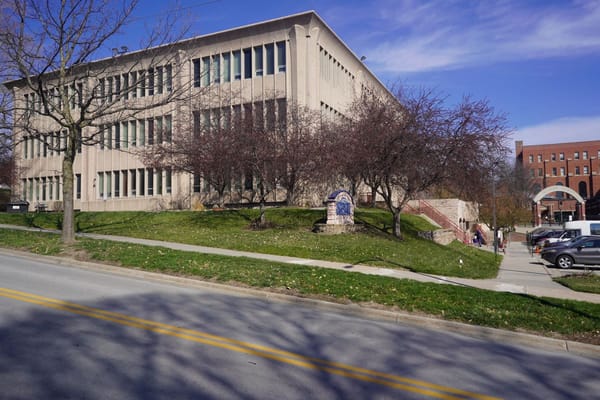Exterior view of Via Christe facility with trees