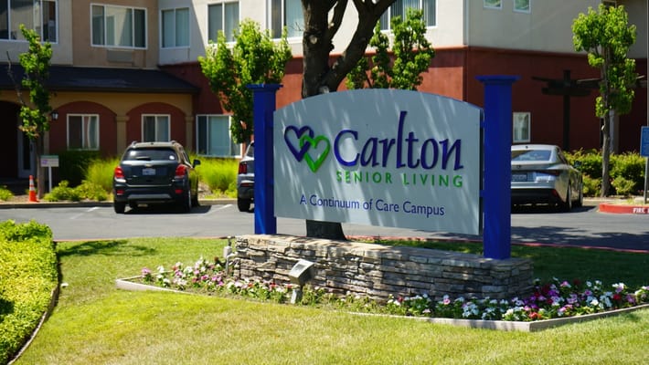 Entrance sign for Carlton Senior Living facility