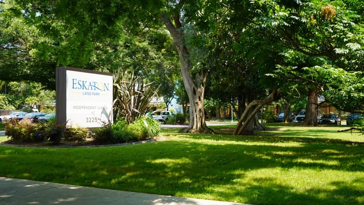 Facility sign in a green outdoor space