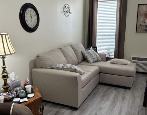 Cozy interior living space with a couch and lamp