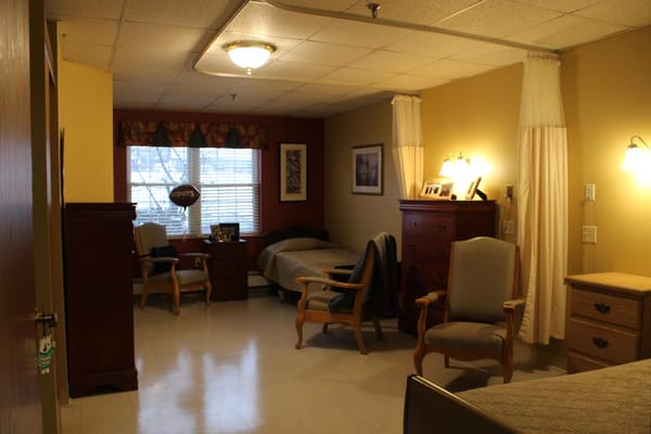 Interior view of a shared resident room with beds and furniture