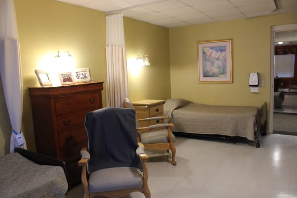 A cozy shared bedroom in a nursing home
