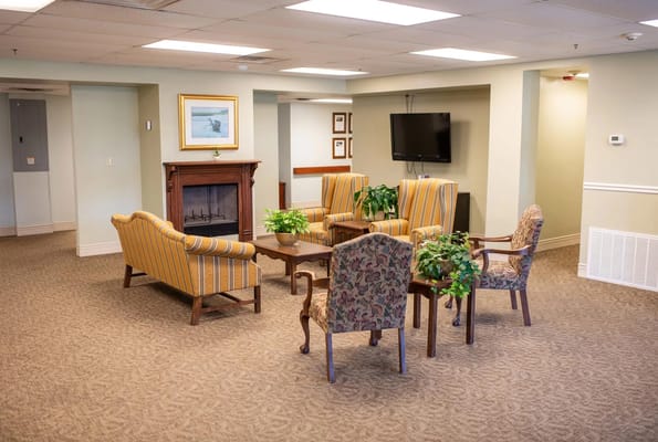 Lounge area with chairs and a television.
