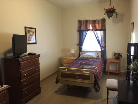 Comfortable private resident room with furnishings