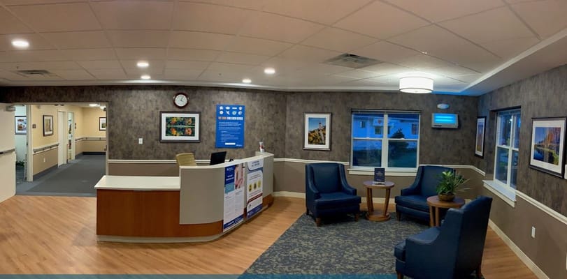 Reception area with seating and artwork displays