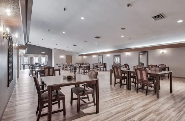 Dining area with tables and chairs arranged neatly