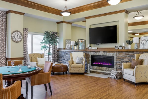 Comfortable common area with seating and a fireplace