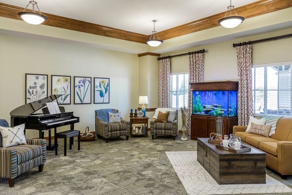 Cozy common area with seating and piano