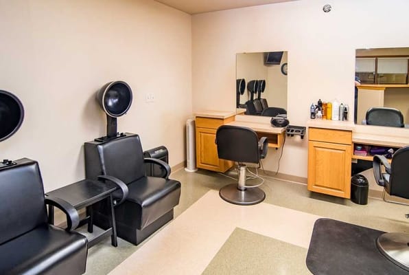 Interior view of a beauty salon with styling chairs