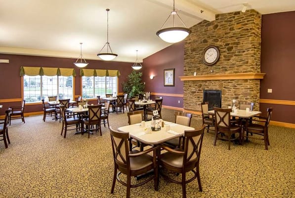 Bright dining room with tables set for meals