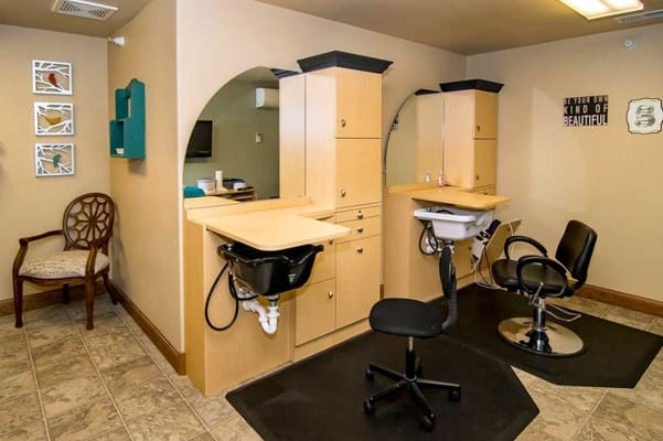 Interior view of a hair salon with styling stations