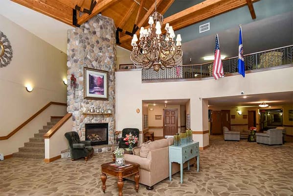 Welcoming lobby area featuring a fireplace and chandelier