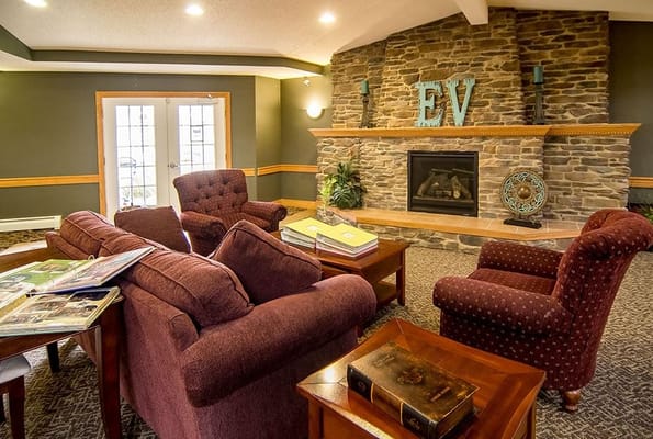 Comfortable seating area with a stone fireplace