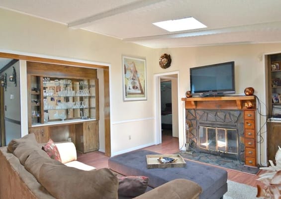 Cozy common area with a fireplace and sofa