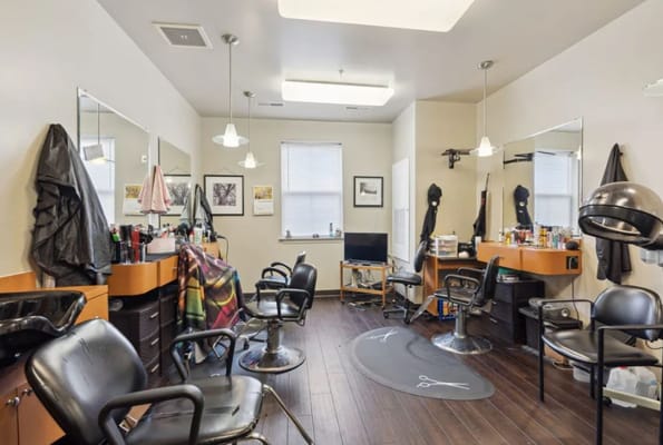 Interior view of a salon with hair styling stations